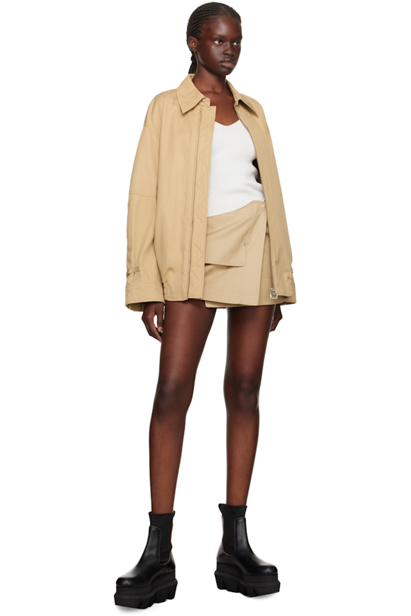 Cotton gabardine skirt. 

· Wrap construction
· Belt loops 
· Adjustable cinch tabs at waistband 
· Four-pocket styling 
· Concealed press-stud and button closure 
· Concealed welt pocket at front 
· Full satin lining
· Logo-engraved silver-tone hardware 

Supplier color: Beige