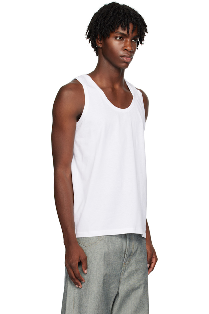 Cotton jersey tank top.

· Scoop neck
· Folded detailing at shoulders
· Extended webbing trim at inner collar

Supplier color: White