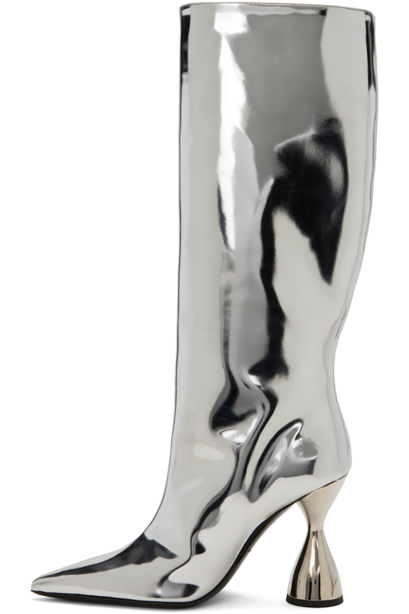 Knee-high patent faux-leather boots in metallic silver-tone.

· Pointed toe
· Grained leather lining
· Sculptural PVC heel with rubber injection
· Leather sole
· Heel: H3.75 in

Supplier color: Silver