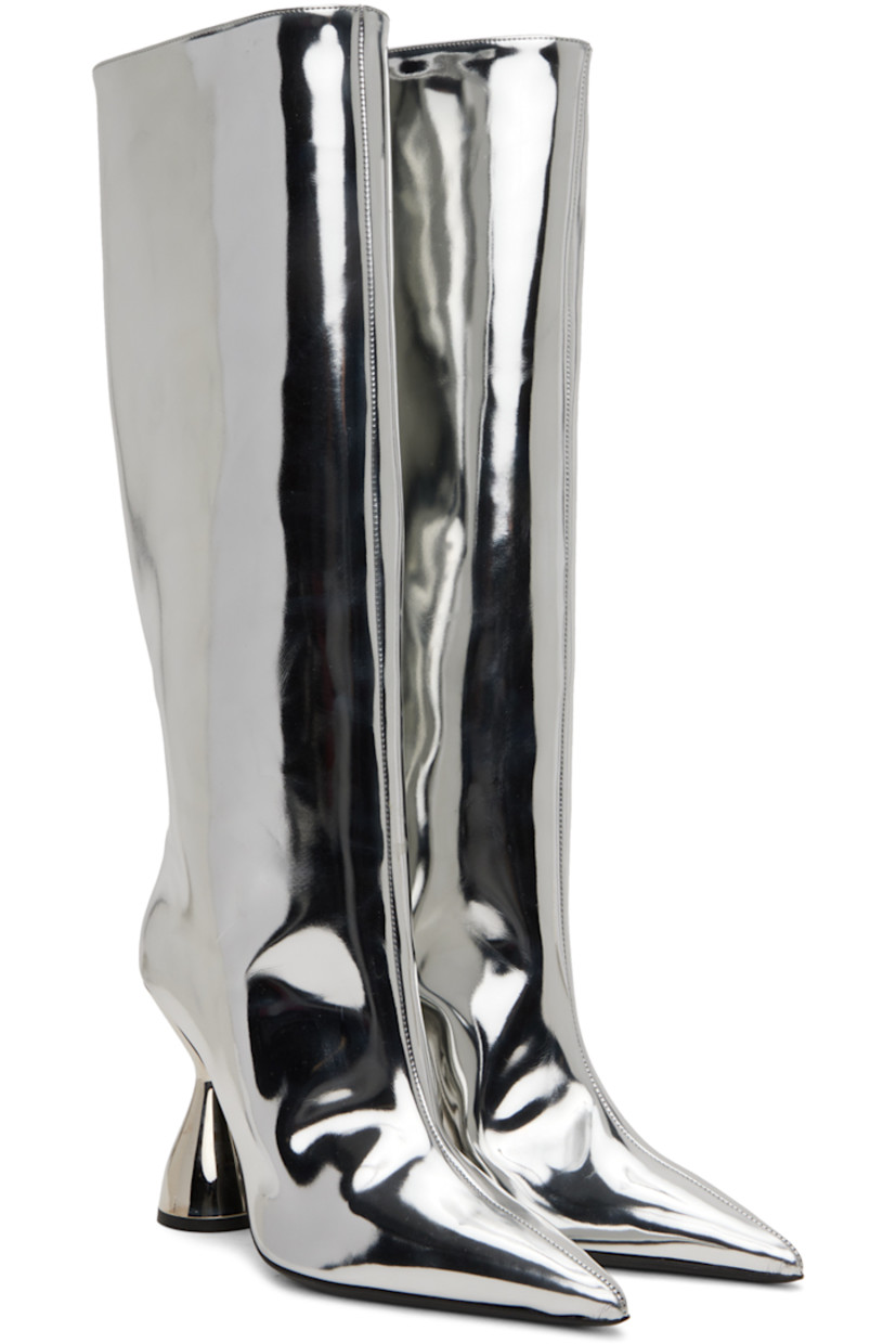 Knee-high patent faux-leather boots in metallic silver-tone.

· Pointed toe
· Grained leather lining
· Sculptural PVC heel with rubber injection
· Leather sole
· Heel: H3.75 in

Supplier color: Silver