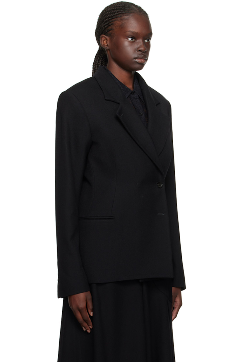Virgin wool twill blazer.

· Peaked lapel
· Double-breasted button closure
· Welt pockets
· Padded shoulders
· Two-button surgeon's cuffs
· Welt pockets at interior
· Full viscose satin lining

Supplier color: Black
