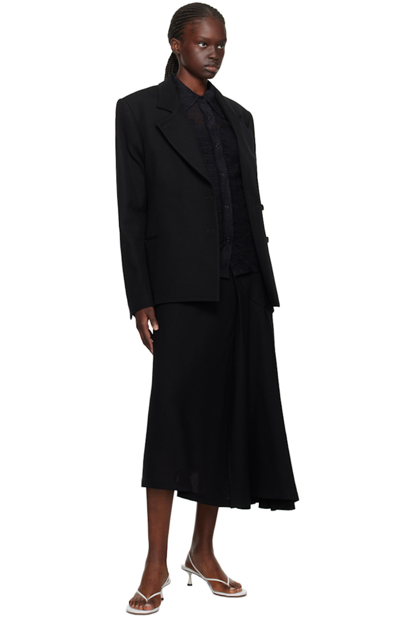 Virgin wool twill blazer.

· Peaked lapel
· Double-breasted button closure
· Welt pockets
· Padded shoulders
· Two-button surgeon's cuffs
· Welt pockets at interior
· Full viscose satin lining

Supplier color: Black