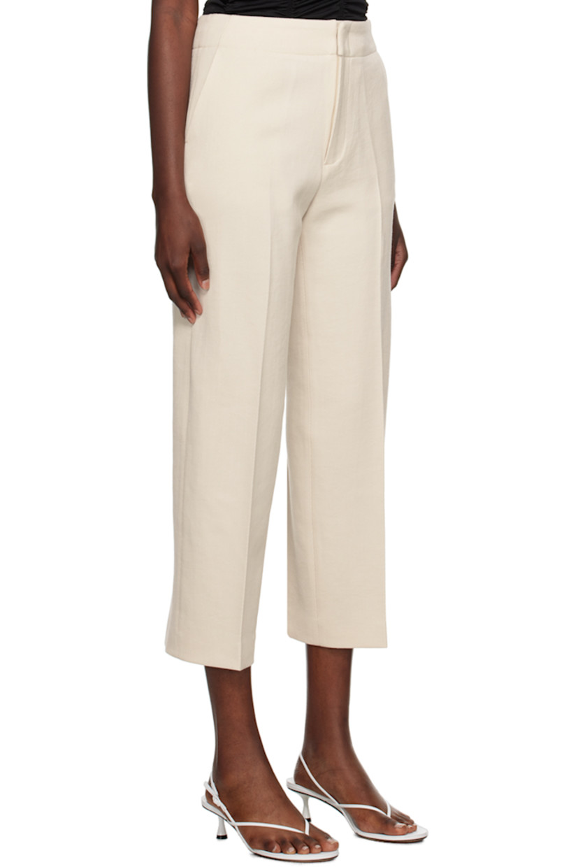 Virgin wool twill trousers.

· Belt loops
· Four-pocket styling
· Zip-fly
· Central crease at front legs
· Cropped cuffs

Supplier color: Cream