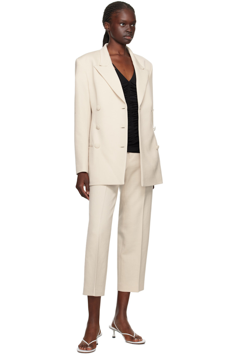 Virgin wool twill trousers.

· Belt loops
· Four-pocket styling
· Zip-fly
· Central crease at front legs
· Cropped cuffs

Supplier color: Cream