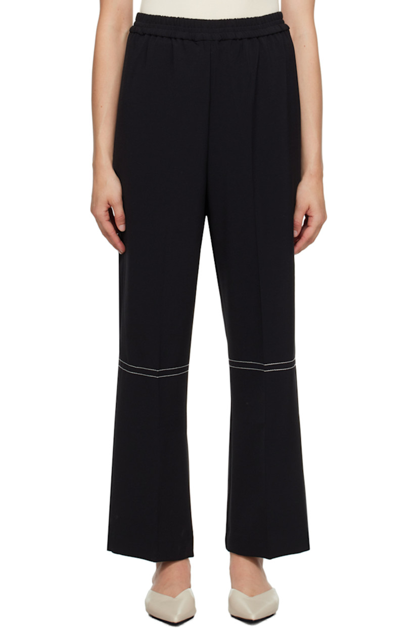 Wide-leg stretch polyester-blend crepe trousers. 

· Elasticized waistband
· Creased legs
· Contrast stitching in white

Supplier color: Black