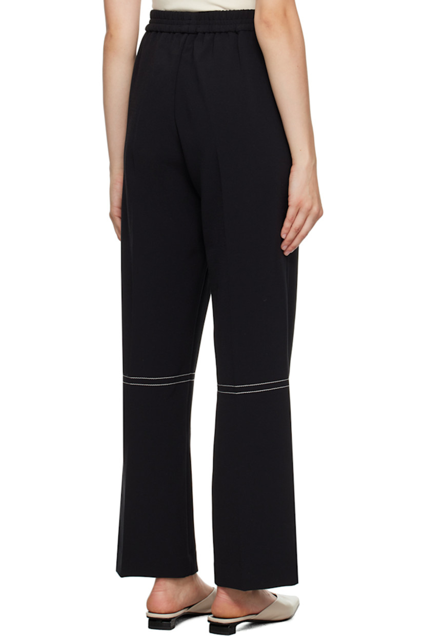 Wide-leg stretch polyester-blend crepe trousers. 

· Elasticized waistband
· Creased legs
· Contrast stitching in white

Supplier color: Black