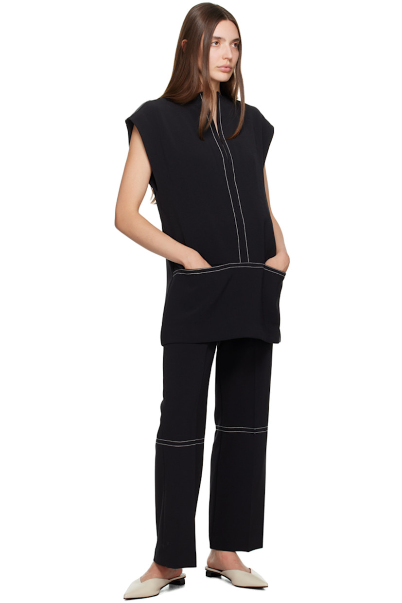 Wide-leg stretch polyester-blend crepe trousers. 

· Elasticized waistband
· Creased legs
· Contrast stitching in white

Supplier color: Black