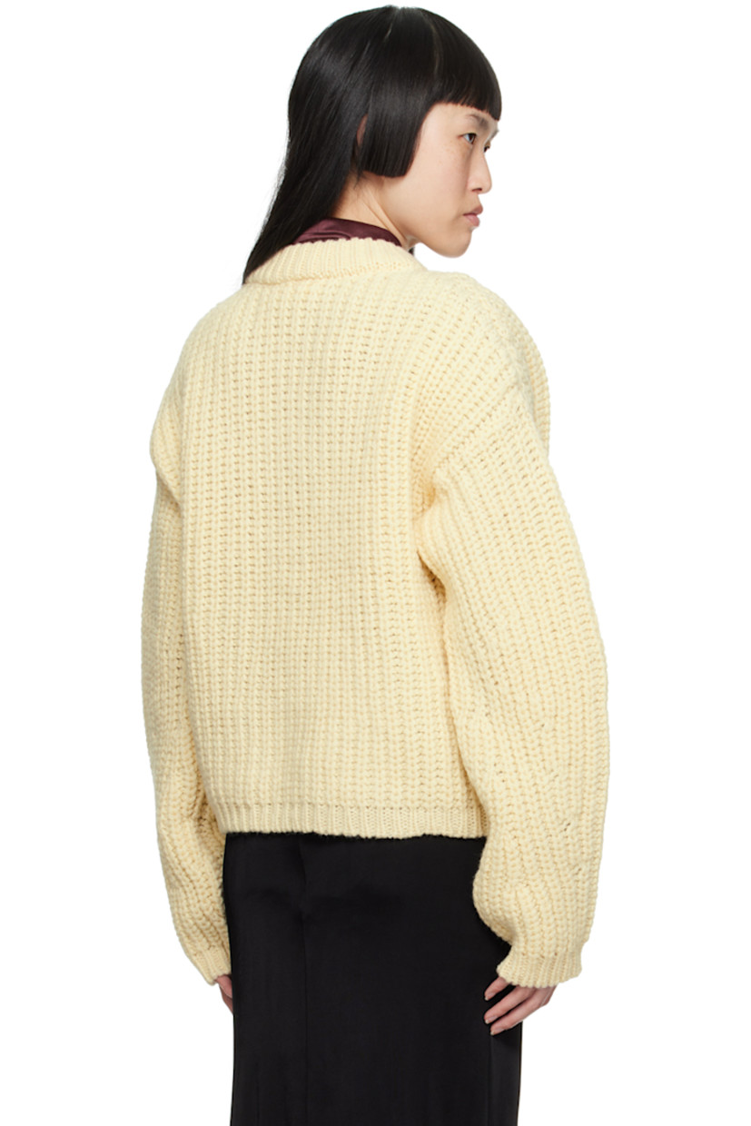Rib knit virgin wool sweater.

· Crewneck
· Dropped shoulders

Supplier color: Cream