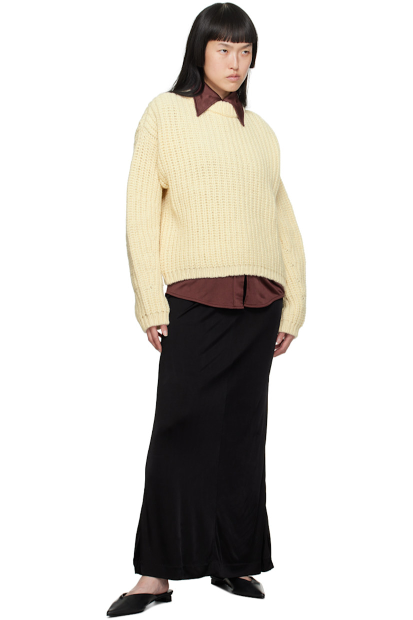 Rib knit virgin wool sweater.

· Crewneck
· Dropped shoulders

Supplier color: Cream