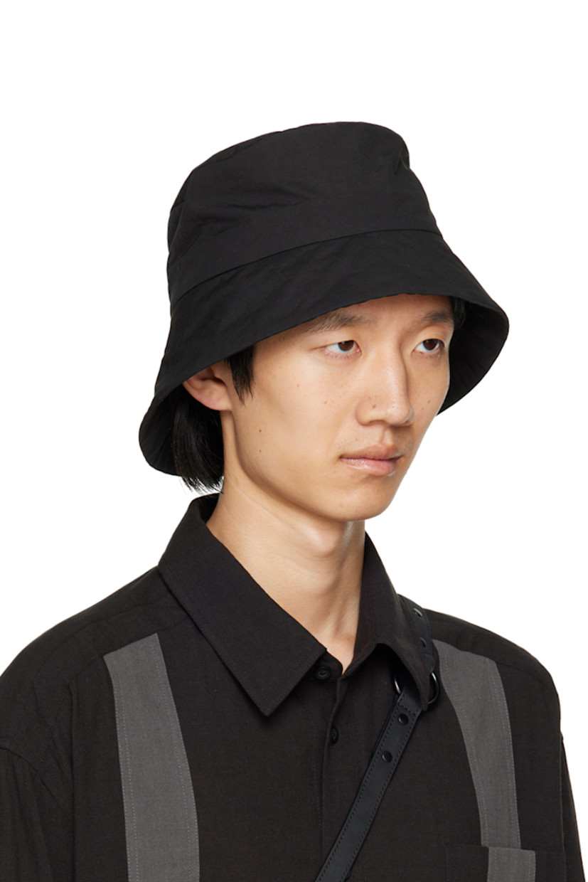 Nylon-blend taffeta bucket hat in black. 

· Detachable press-stud tab at face
· Unlined

Supplier color: Black