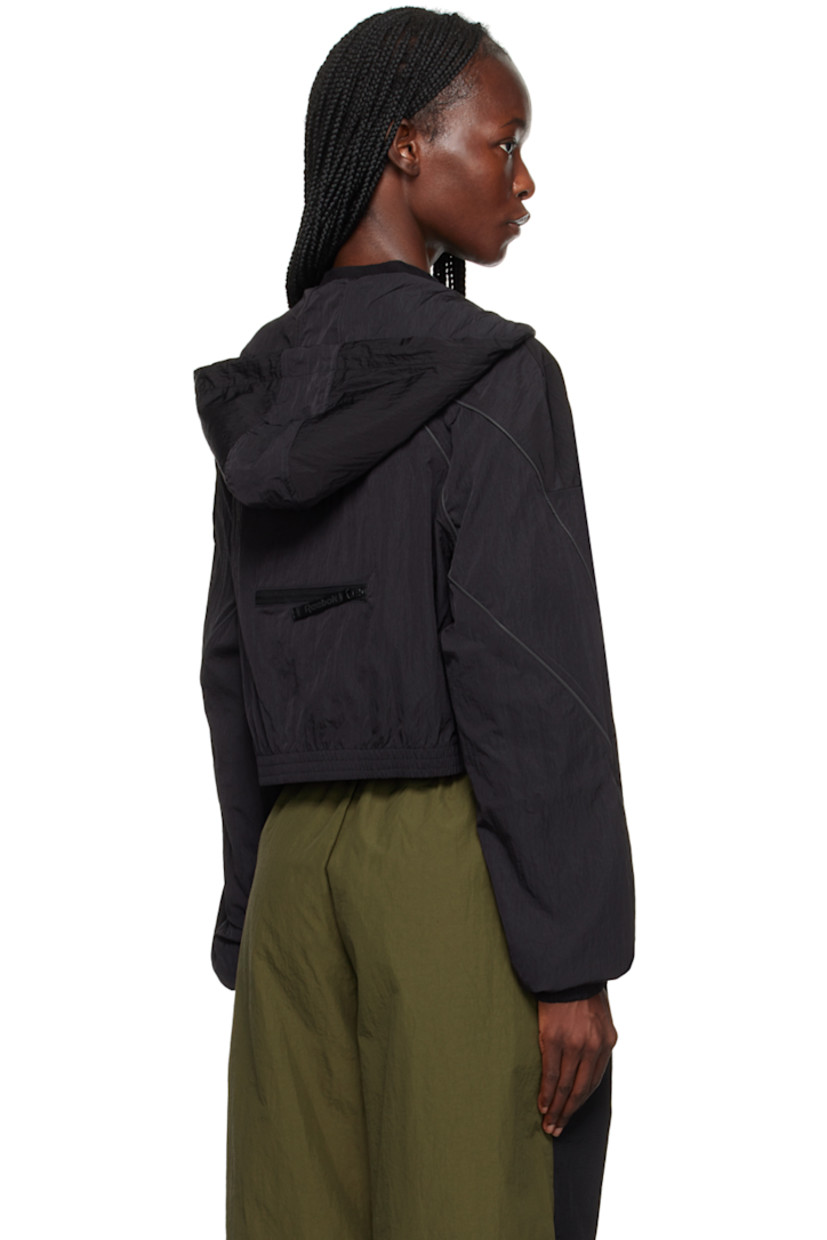 Nylon taffeta jacket.

· Drawstring at hood
· Zip closure
· Rubberized logo patch at chest
· Elasticized cropped hem and cuffs
· Piping at sleeves 
· Zip pocket at back 
· Unlined  

Supplier color: Black
