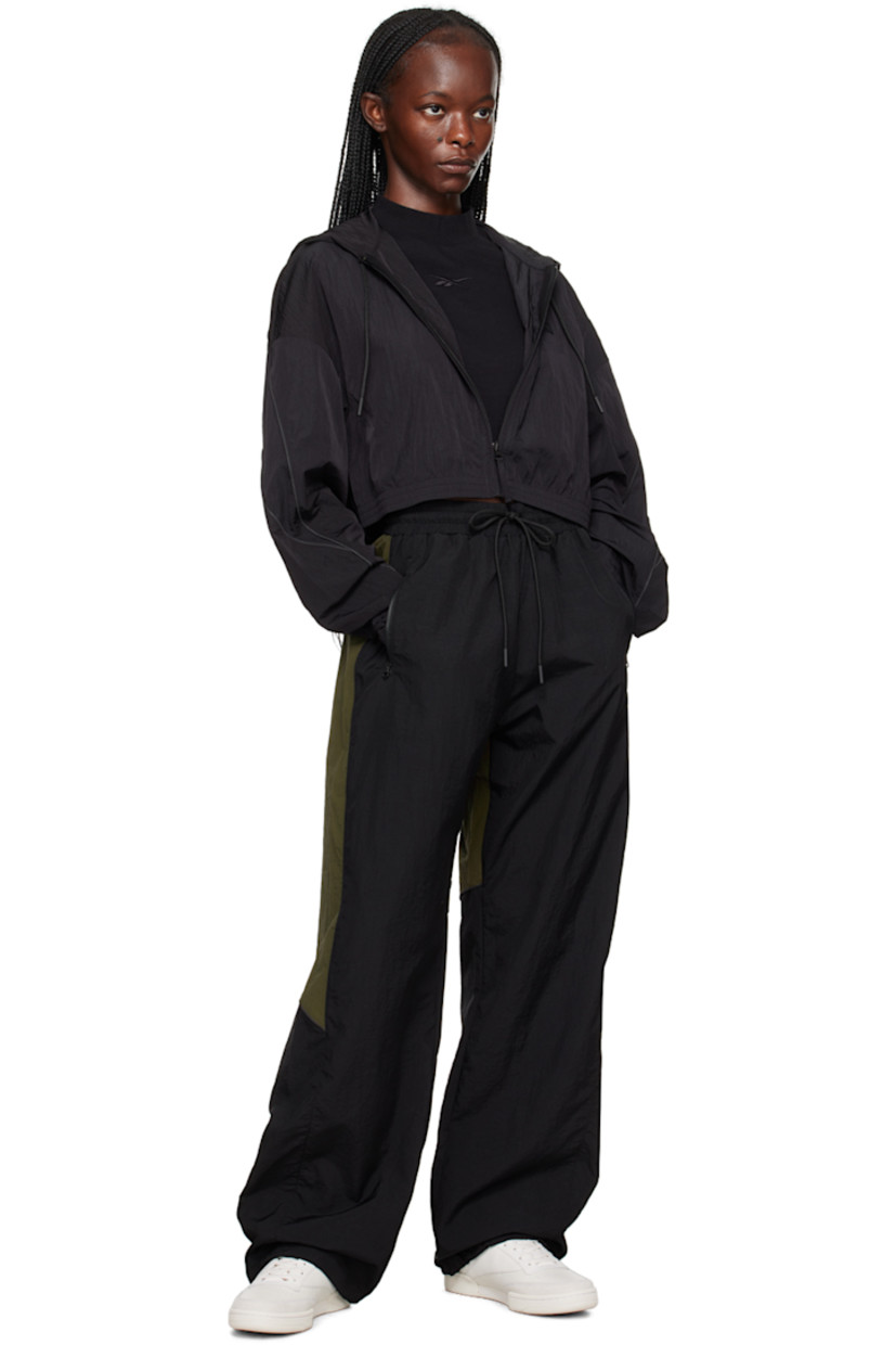 Nylon taffeta jacket.

· Drawstring at hood
· Zip closure
· Rubberized logo patch at chest
· Elasticized cropped hem and cuffs
· Piping at sleeves 
· Zip pocket at back 
· Unlined  

Supplier color: Black