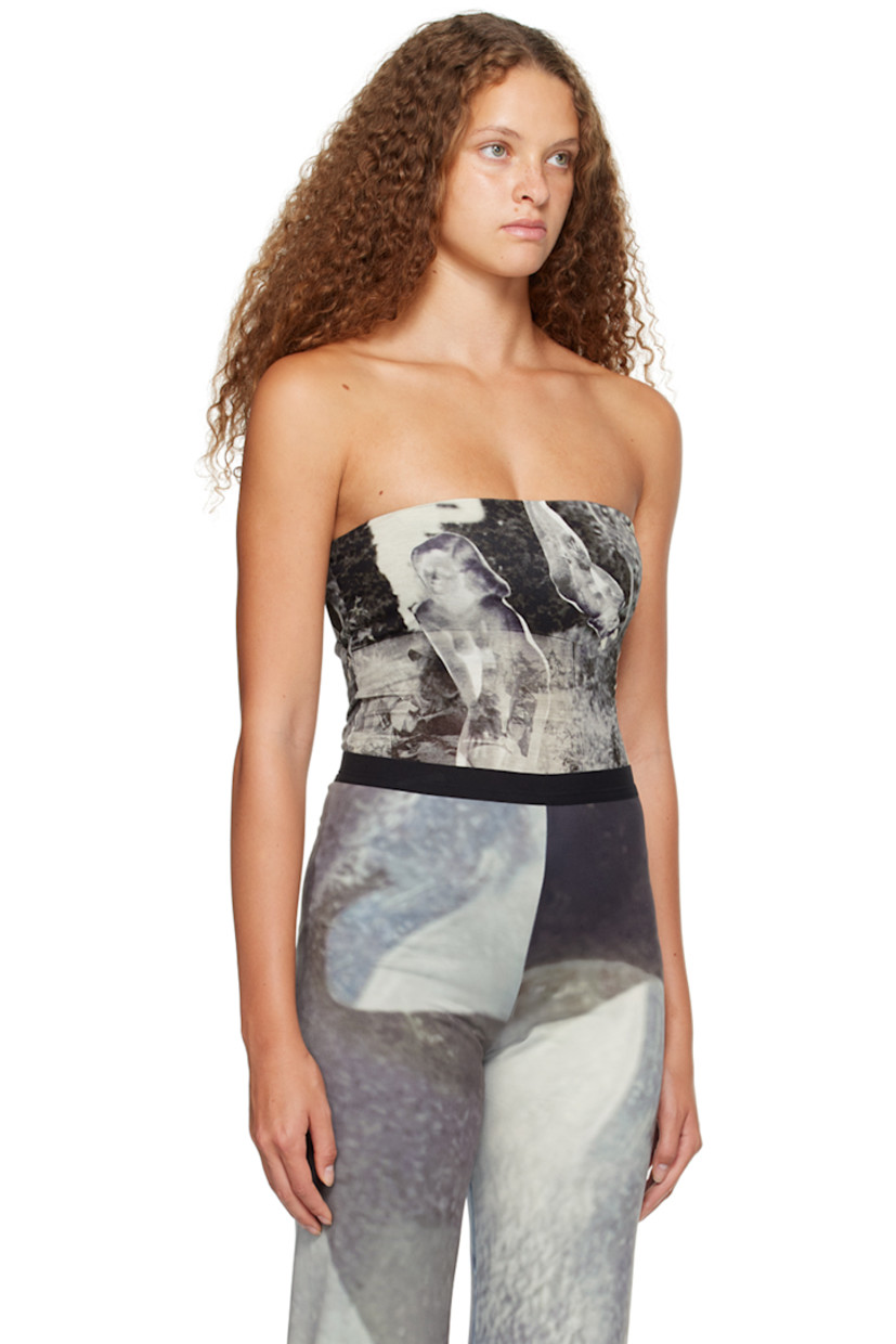 ECOVERO™-certified stretch viscose jersey bodysuit. Graphics printed throughout. 

· Straight neck 
· Adjustable press-stud fastening at bottom 

Supplier color: Print multi
