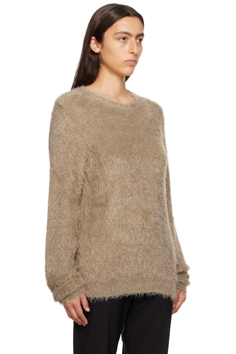 Shag knit nylon sweater. 

· Rib knit crewneck, hem, and cuffs
· Logo hardware at hem

Supplier color: Tan