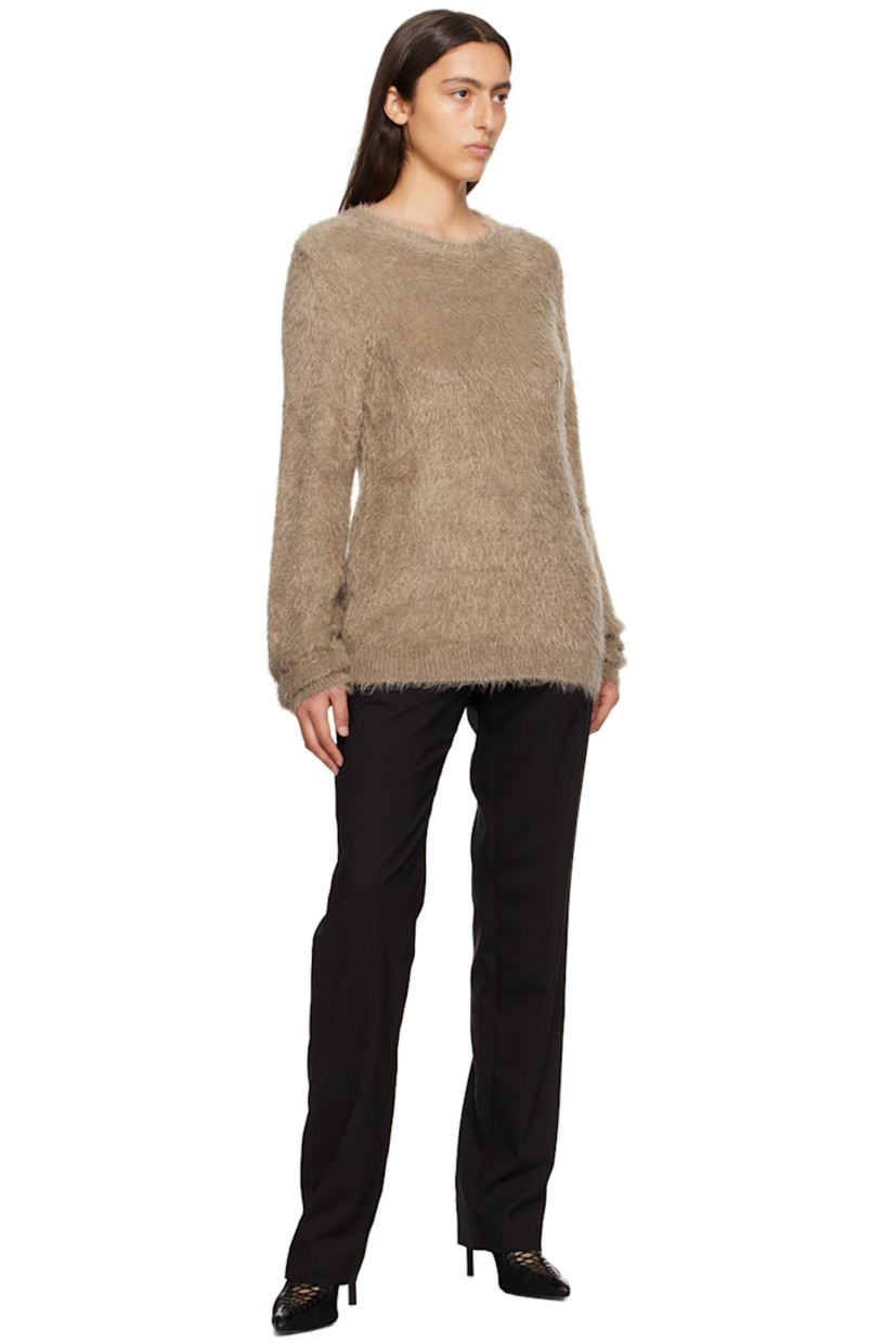 Shag knit nylon sweater. 

· Rib knit crewneck, hem, and cuffs
· Logo hardware at hem

Supplier color: Tan