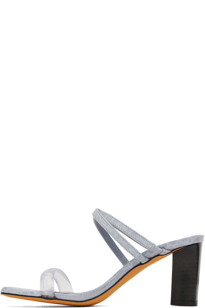 Croc-embossed calfskin heeled sandals in blue. 

· Open toe 
· PVC and elasticized straps at vamp 
· Logo embossed at leather footbed 
· Leather block heel with rubber injection 
· Nubuck sole 
· Heel: H2.75" 

Supplier color: Icicle