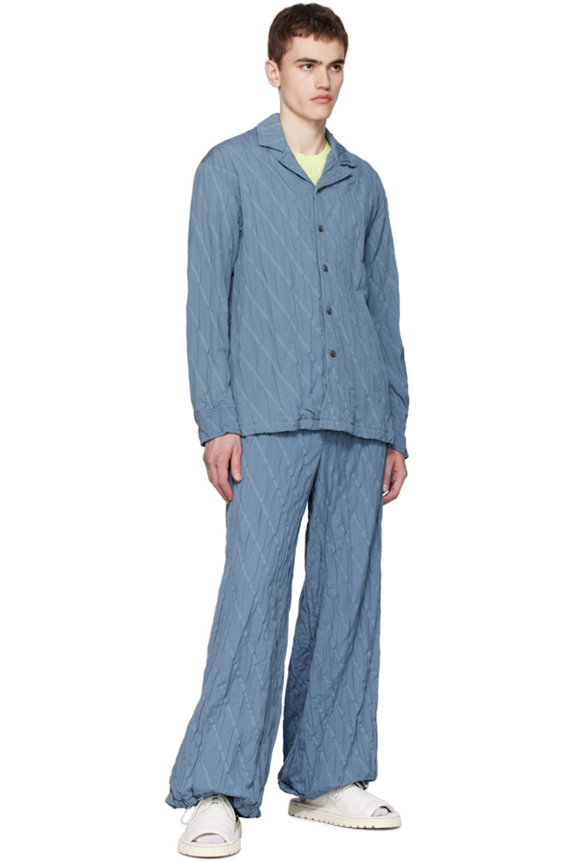 Garment-pleated plain-woven cotton-blend shirt. Jacquard stripes throughout.

· Open spread collar
· Button closure
· Adjustable single-button barrel cuffs

Supplier color: Blue