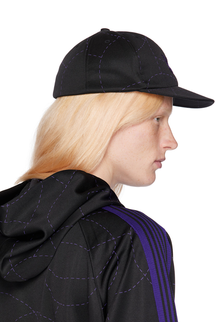Jersey cap in black.

· Graphic pattern printed throughout
· Embroidered eyelets at crown
· Logo embroidered at face
· Flat brim
· Mesh lining

Part of the NEEDLES x DC collaboration.

Supplier color: Black