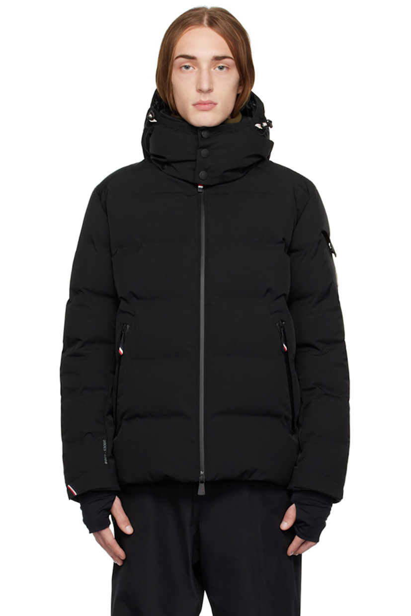 Down-filled quilted 2L stretch nylon twill jacket. Water-repellent, windproof, lightweight, and breathable.

· Detachable hood
· Bungee-style drawstring and press-stud fastening at hood
· Stand collar
· Two-way zip closure 
· Zip pockets
· Bungee-style drawstring at hem
· Embroidered logo patch and flap pocket at sleeve
· Velcro strap at cuffs
· Thumbhole at inset jersey cuffs
· Zip pocket and powder skirt at interior
· Nylon satin lining
· YKK® Aquaguard® hardware

Supplier color: Black

Fill: 90% goose down, 10% feathers.