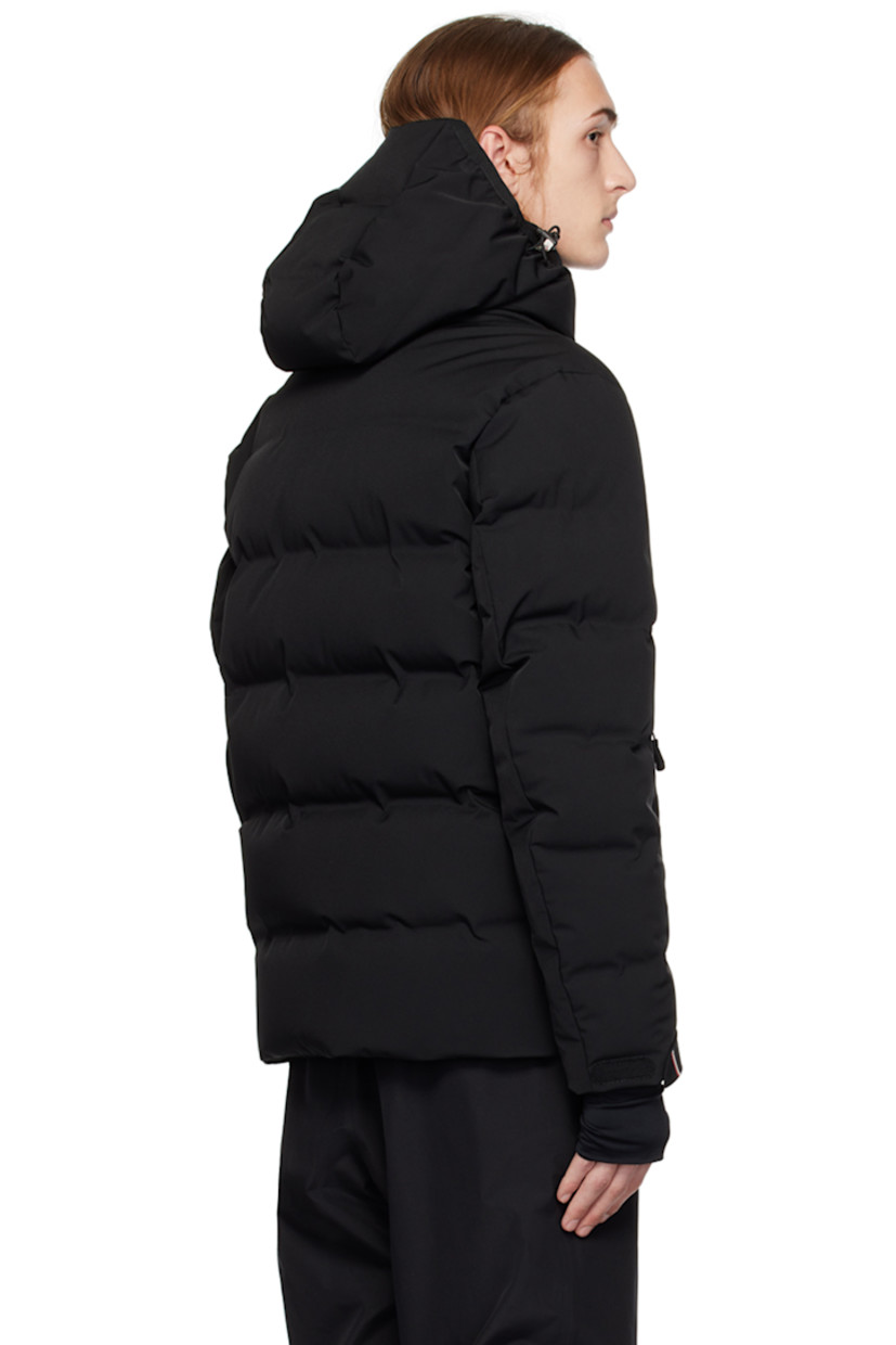 Down-filled quilted 2L stretch nylon twill jacket. Water-repellent, windproof, lightweight, and breathable.

· Detachable hood
· Bungee-style drawstring and press-stud fastening at hood
· Stand collar
· Two-way zip closure 
· Zip pockets
· Bungee-style drawstring at hem
· Embroidered logo patch and flap pocket at sleeve
· Velcro strap at cuffs
· Thumbhole at inset jersey cuffs
· Zip pocket and powder skirt at interior
· Nylon satin lining
· YKK® Aquaguard® hardware

Supplier color: Black

Fill: 90% goose down, 10% feathers.
