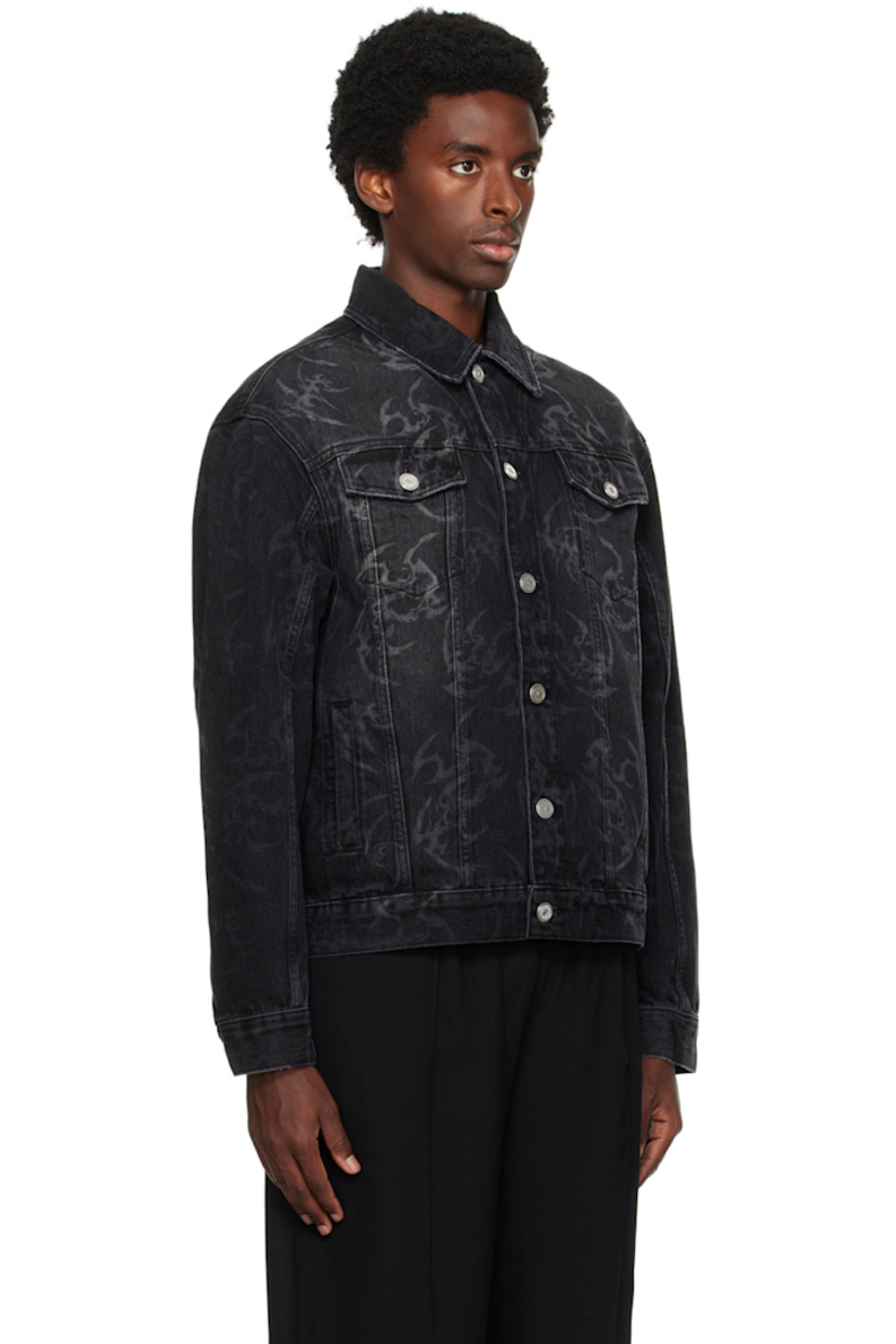 Non-stretch denim jacket. Fading, subtle distressing, and graphic pattern printed throughout. 

· Spread collar
· Button closure
· Flap and welt pockets
· Adjustable single-button barrel cuffs
· Adjustable button tabs at back hem 
· Unlined
· Logo-engraved silver-tone hardware

Supplier color: Black