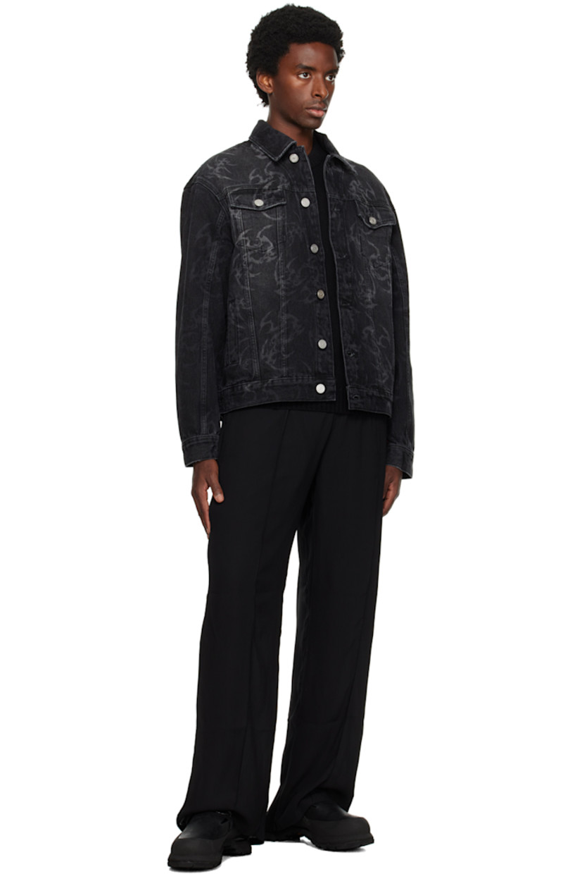 Non-stretch denim jacket. Fading, subtle distressing, and graphic pattern printed throughout. 

· Spread collar
· Button closure
· Flap and welt pockets
· Adjustable single-button barrel cuffs
· Adjustable button tabs at back hem 
· Unlined
· Logo-engraved silver-tone hardware

Supplier color: Black