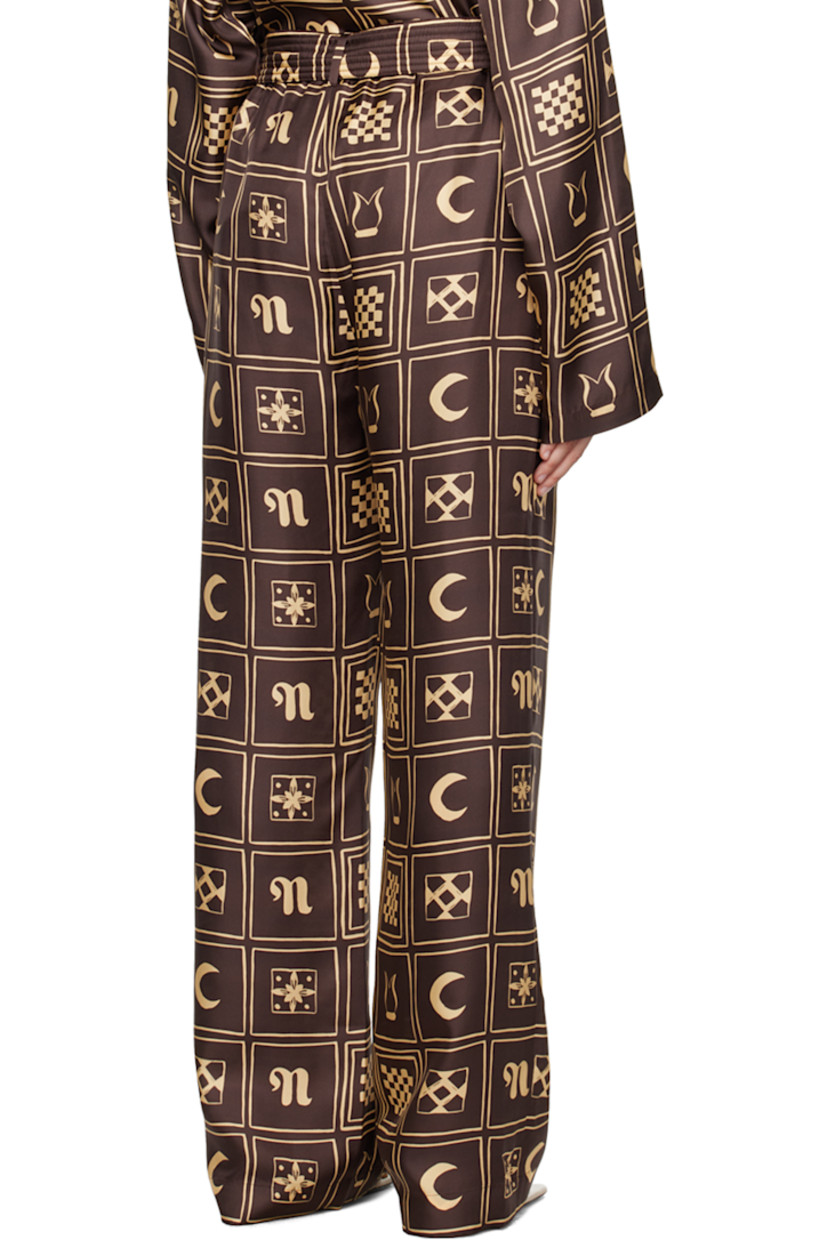 Straight-leg silk satin trousers. Graphic pattern printed throughout.

· Belt loops
· Self-tie belt at elasticized waistband
· Two-pocket styling

Supplier color: Apricot totem inverse brown
