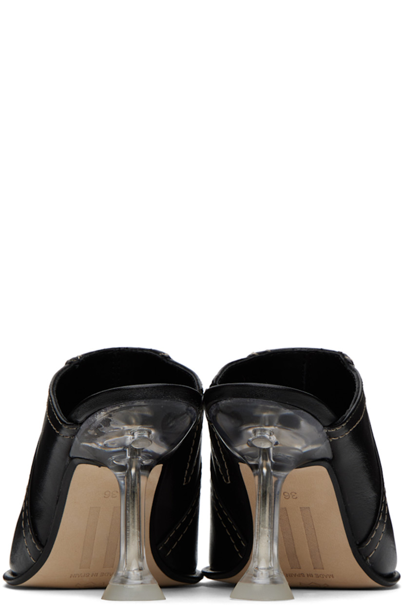 Pair of grained lambskin heels in black. 

· Pointed toe
· Plexiglass spool heel with rubber injection
· Leather sole with rubber injection
· Contrast stitching in beige
· Heel: H3.25"

Supplier color: Black