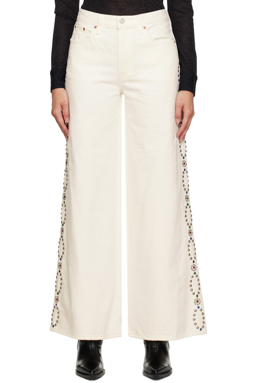 Wide-leg non-stretch denim jeans. Subtle distressing throughout. 

· Belt loops 
· Five-pocket styling 
· Zip-fly 
· Beaded detailing and studs at outseams 
· Leather logo patch at back waistband 
· Logo flag at back pocket 

Supplier color: White