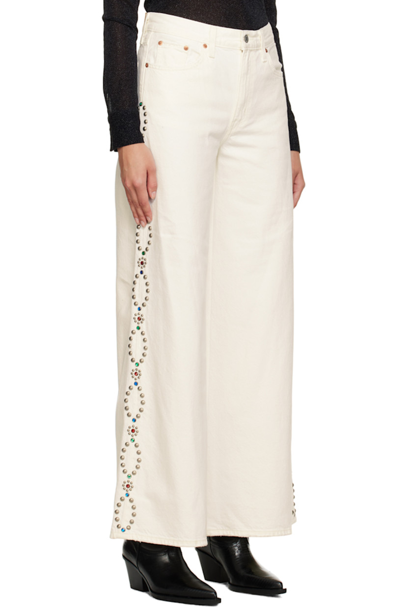 Wide-leg non-stretch denim jeans. Subtle distressing throughout. 

· Belt loops 
· Five-pocket styling 
· Zip-fly 
· Beaded detailing and studs at outseams 
· Leather logo patch at back waistband 
· Logo flag at back pocket 

Supplier color: White