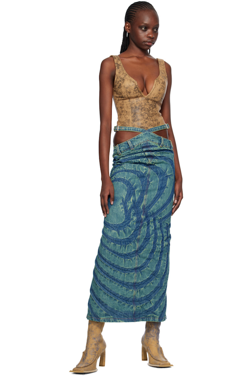 Bias-cut non-stretch denim skirt. Fading and creased graphics throughout.

· Asymmetrical construction
· Pin-buckle straps and cutouts at waist
· Belt loops
· Mock-fly
· Vent at back
· Contrast stitching in red

Supplier color: Fern