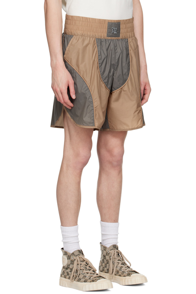 Nylon taffeta shorts. Piping throughout. 

· Paneled construction
· Logo embroidered at elasticized waistband 
· Two-pocket styling
· Zip-fly 
· Vented outseam 
· Briefs-style mesh lining 
· Logo-engraved antiqued silver-tone hardware

Part of the MISBHV x Jordan Barrett collaboration. 

Supplier color: Grey