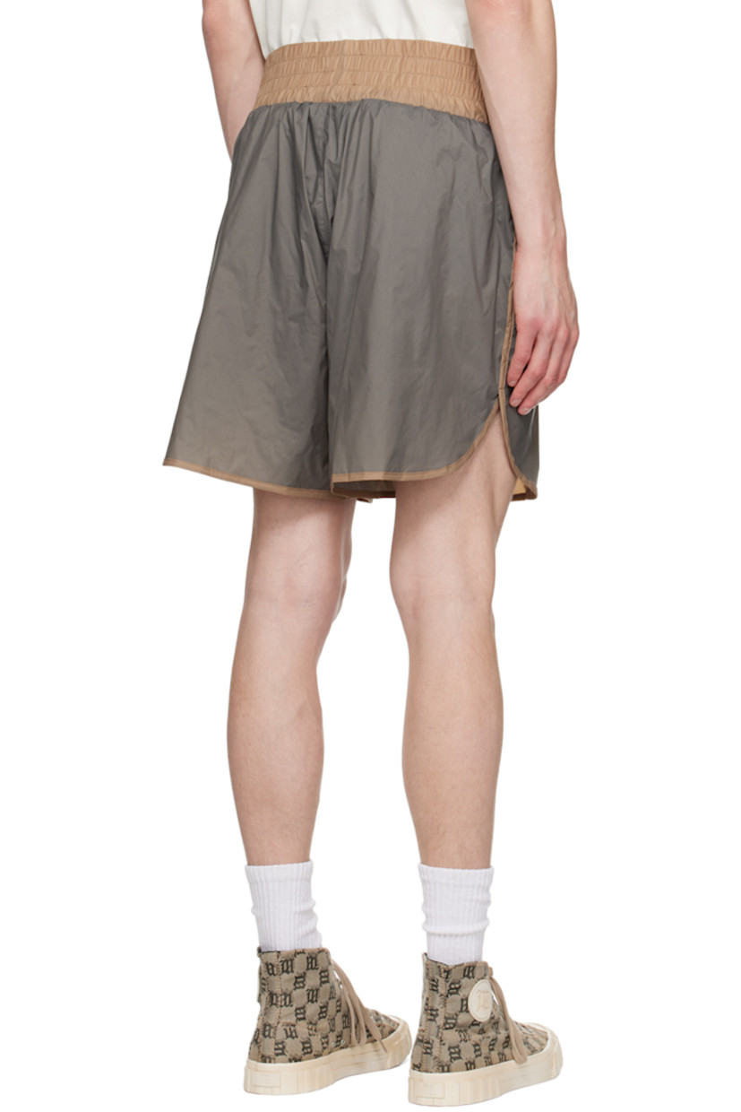 Nylon taffeta shorts. Piping throughout. 

· Paneled construction
· Logo embroidered at elasticized waistband 
· Two-pocket styling
· Zip-fly 
· Vented outseam 
· Briefs-style mesh lining 
· Logo-engraved antiqued silver-tone hardware

Part of the MISBHV x Jordan Barrett collaboration. 

Supplier color: Grey