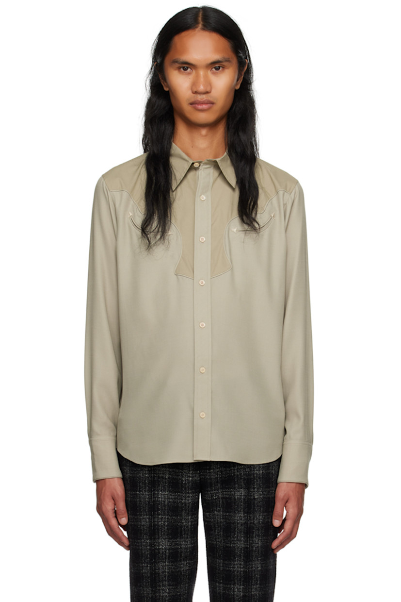 Paneled wool delaine and cotton poplin shirt.

· Spread collar
· Button closure
· Welt pockets at chest
· Scalloped seam at front and back yoke 
· Shirttail hem
· Adjustable three-button barrel cuffs
· Partial charmeuse lining

Supplier color: Mist