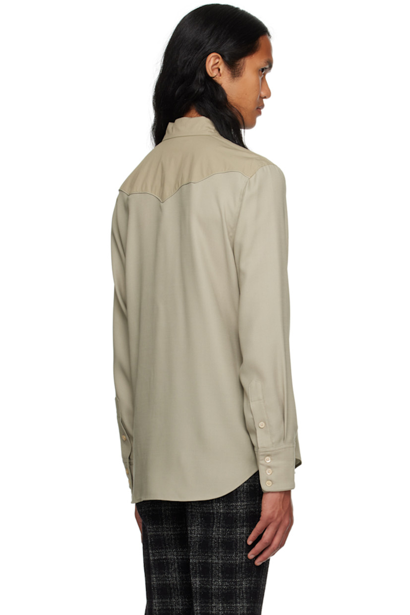 Paneled wool delaine and cotton poplin shirt.

· Spread collar
· Button closure
· Welt pockets at chest
· Scalloped seam at front and back yoke 
· Shirttail hem
· Adjustable three-button barrel cuffs
· Partial charmeuse lining

Supplier color: Mist