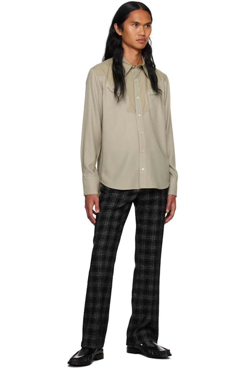 Paneled wool delaine and cotton poplin shirt.

· Spread collar
· Button closure
· Welt pockets at chest
· Scalloped seam at front and back yoke 
· Shirttail hem
· Adjustable three-button barrel cuffs
· Partial charmeuse lining

Supplier color: Mist