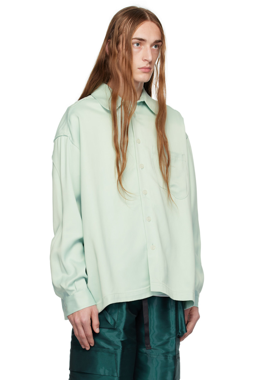 Viscose twill shirt. 

· Spread collar
· Button closure
· Logo embroidered at patch pocket
· Logo flag at side seam
· Single-button barrel cuffs
· Inverted box pleat at back yoke

Supplier color: Ice/Ice
