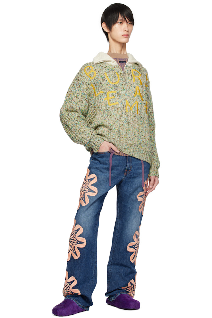 Hand-painted rib knit merino wool sweater. Drawstrings and laddering throughout.

· Mock neck
· Logo patch at collar
· Raglan sleeves

Supplier color: Beige