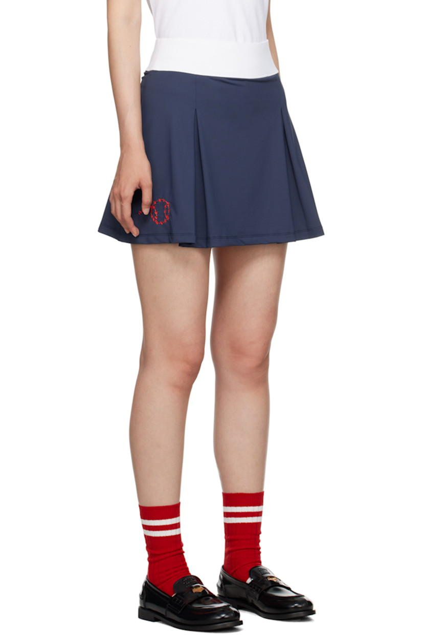 Stretch nylon jersey skort.

· Elasticized waistband
· Inverted pleats at front
· Logo and graphic embroidered at side seams

Available exclusively at SSENSE.

Supplier color: Navy