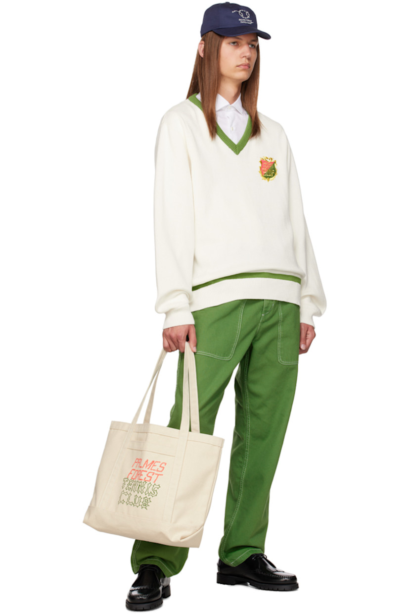 Knit wool sweater. 

· Rib knit V-neck, hem, and cuffs 
· Embroidered logo patch at chest

Available exclusively at SSENSE. 

Supplier color: Off-white/Green