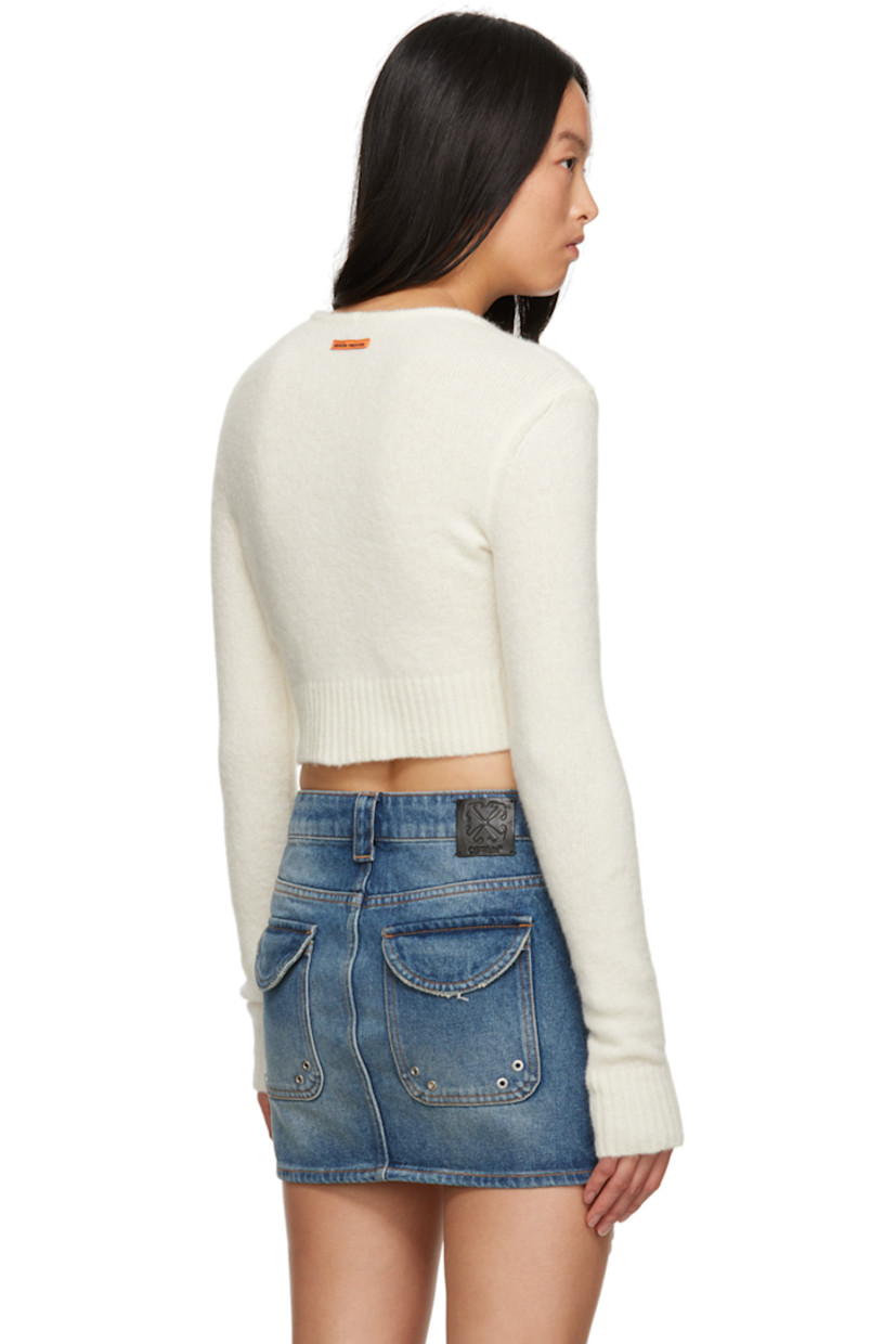 Brushed knit stretch acrylic- and nylon-blend cardigan.

· Y-neck
· Lanyard clasps at open front
· Rib knit cropped hem and cuffs 
· Logo patch at back collar

Supplier color: Ivory