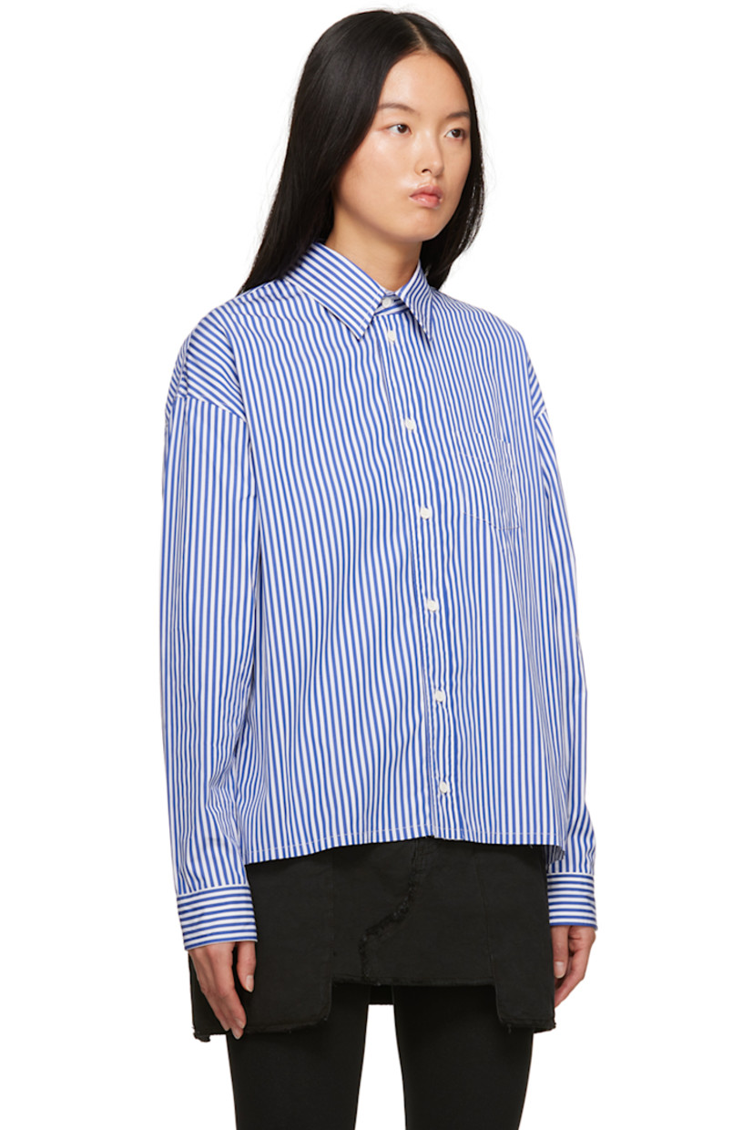 Cotton poplin shirt. Stripes throughout.

· Spread collar
· Button closure
· Patch pocket at chest
· Shirttail hem
· Single-button barrel cuffs
· Logo patch at cuff
· Graphic and text printed at back

Supplier color: Blue/Fuchsia