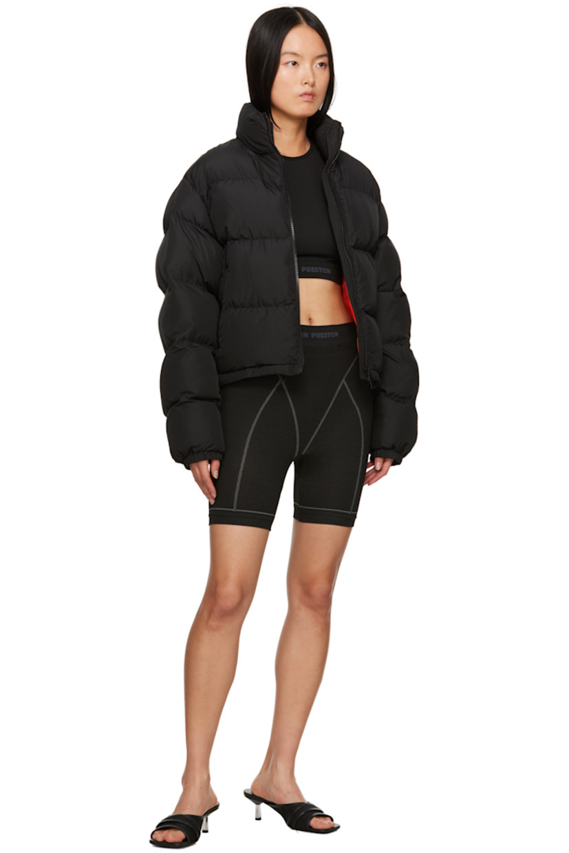 Stretch nylon jersey top. Garter stitch detailing throughout.

· Crewneck
· Intarsia logo at cropped elasticized hem
· Rib knit cuffs
· Logo patches at back collar

Supplier color: Black/White