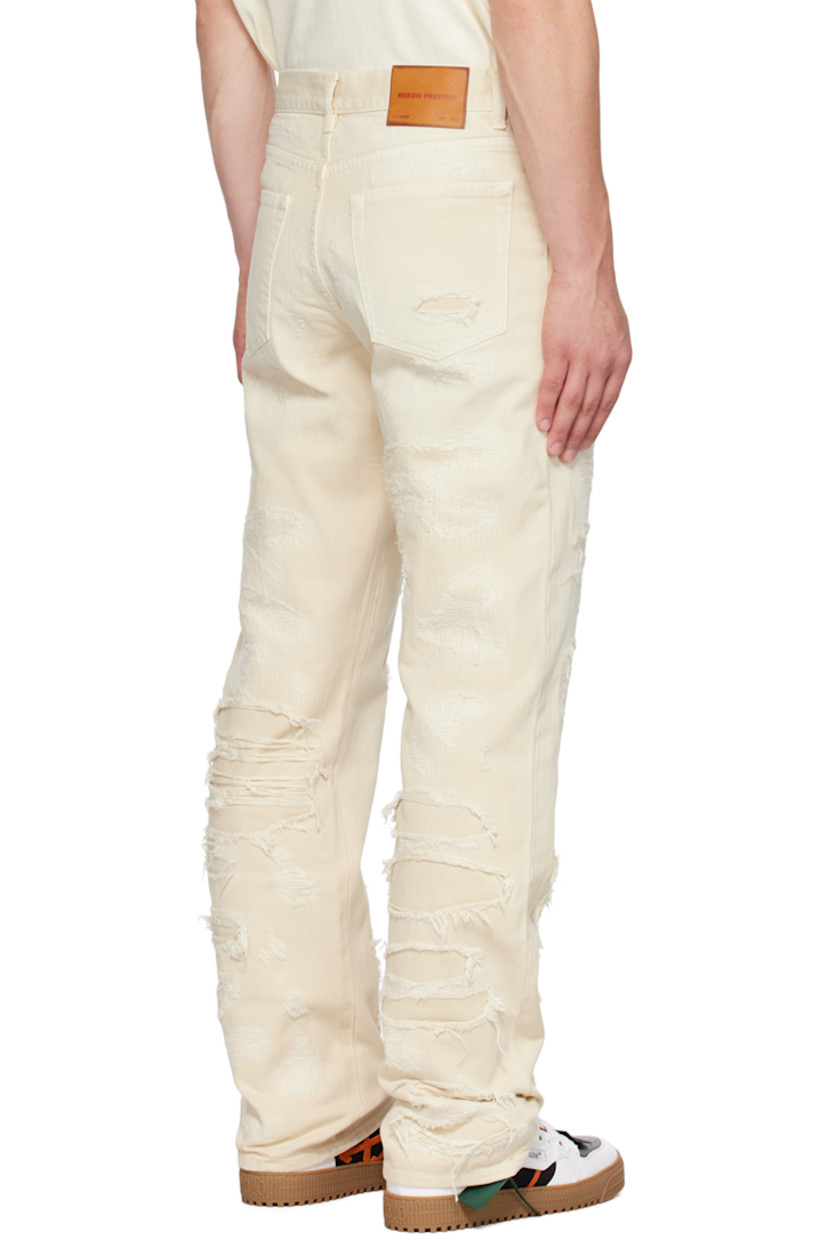 Straight-leg non-stretch denim jeans. Distressing, topstitching, and underlays throughout. 

· Paneled construction 
· Belt loops
· Button-fly
· Five-pocket styling
· Leather logo patch at back waistband
· Logo-engraved silver-tone hardware

Supplier color: Ivory