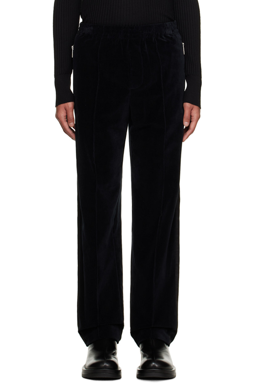Cotton velvet trousers. 

· Concealed drawstring at elasticized waistband
· Four-pocket styling
· Button-fly
· Pinched seams at front legs
· Cupro satin trim at outseam

Supplier color: Black