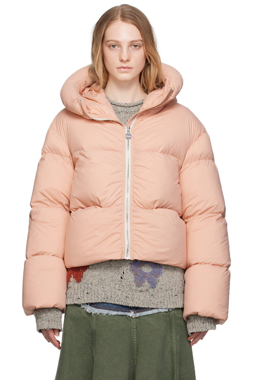 Down-filled quilted lightweight nylon satin jacket. Water- and wind-repellent. 

· Hood at funnel neck
· Zip closure
· Welt pockets 
· Bungee-style drawstring at cropped hem
· Elasticized cuffs
· Fully lined 
· Logo-engraved silver-tone hardware

Supplier color: Soft pale pink

Fill: 95% white goose down, 5% feathers.