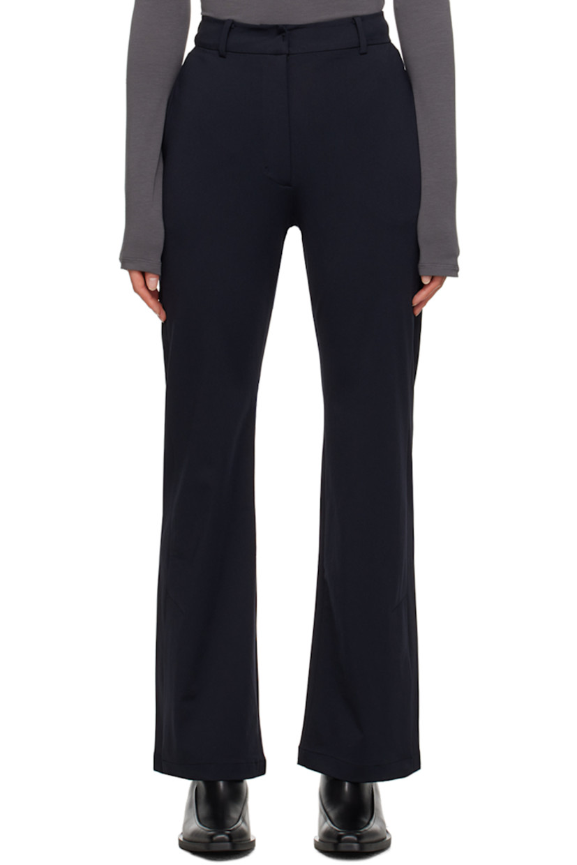 Wide-leg stretch nylon jersey trousers.

· High-rise
· Belt loops
· Four-pocket styling
· Zip-fly
· Press-stud vent at cuffs

Supplier color: Navy