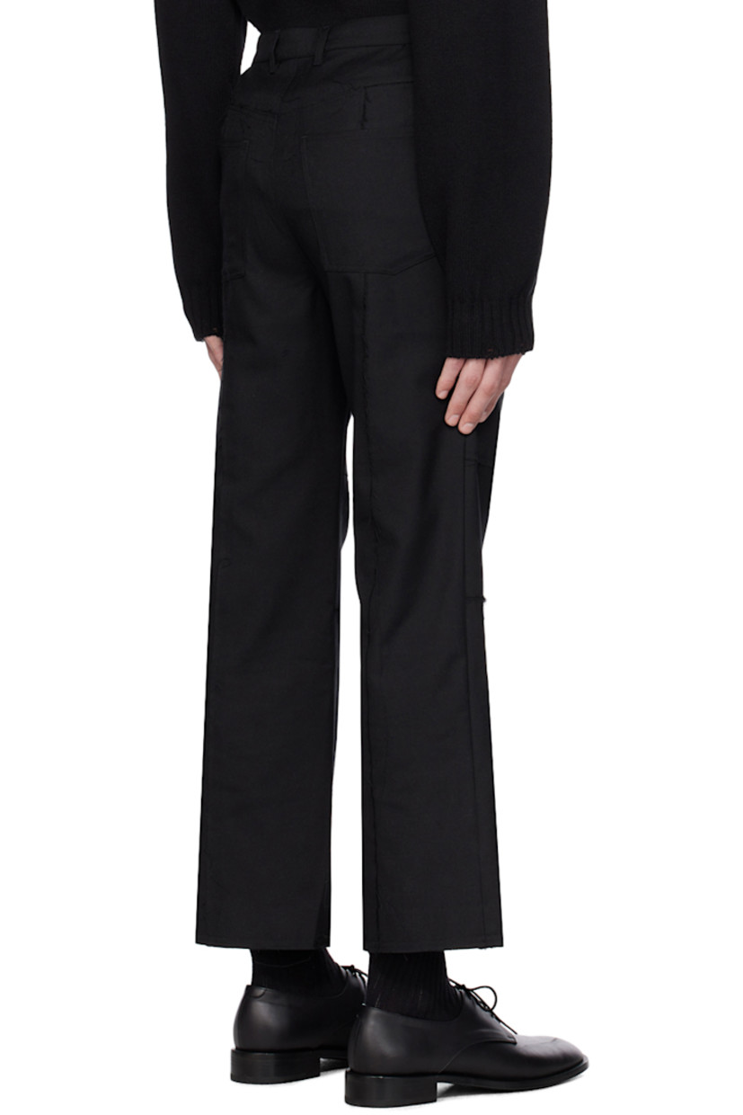 Polyester- and rayon-blend twill trousers. Loose thread detailing throughout.

· Paneled construction
· Belt loops
· Four-pocket styling
· Zip-fly
· Raw edge and subtle flare at cuffs

Supplier color: Black