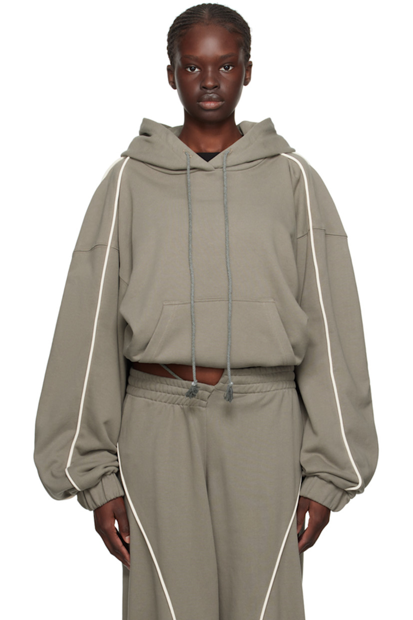 French terry hoodie.

· Drawstring at hood
· Kangaroo pocket
· Elasticized cropped hem and cuffs
· Piping at sleeves
· Dropped shoulders

Supplier color: Sage