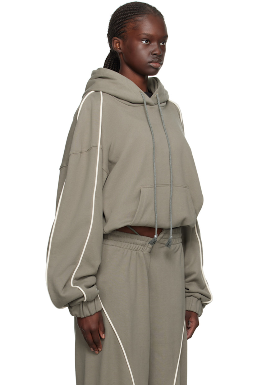 French terry hoodie.

· Drawstring at hood
· Kangaroo pocket
· Elasticized cropped hem and cuffs
· Piping at sleeves
· Dropped shoulders

Supplier color: Sage